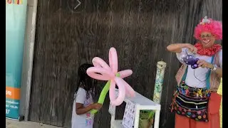 Silly Jilly Keeps Her Balloon Line Moving Fast as She Makes One Balloon Per Minute