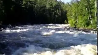 White water rafting through the last rapid at Kipawa river, Quebec, Canada