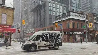 Walking in the snow !   Walking north on Yonge street during a snow storm. Talking local economics 