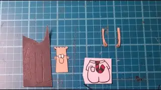 I'm making paper cutouts for my next cartoon! RIP Scott Adams, Dilbert tribute cutout in progress.