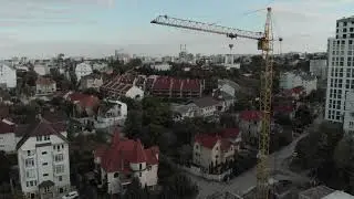A builder inspects a high-rise building. Modern construction.( Video Background Stock Footage Free )