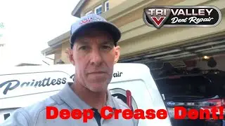 Subaru deep crease dent fixed using paintless dent repair method