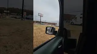 Hurricane Mills Tennessee watching trucks