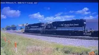 (couldn't film it myself) Florida East Coast track geometry train thunders by Melbourne crossing