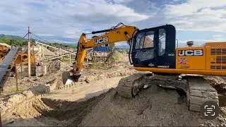 Video Of An Excavator Cleaning A Crusher Drain / Heavy Equipment / Mountain Rock