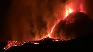 Lava From Erupting Mount Etna Glows Red Against Night Sky