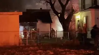 Scene video: Omaha firefighters pull person through window of burning home