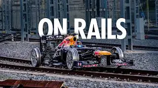 Driving a Formula 1 Car on Train Tracks