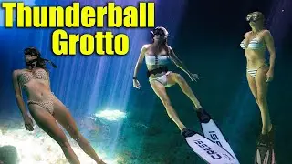 Beautiful women dive at Thunderball Grotto