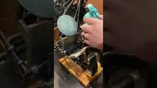 Cleaning the tabletop printing press with a Grip Clean hand wipe