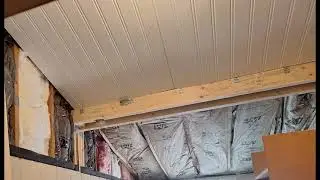 Water damaged ceiling and support beam removed. New ceiling, beam, insulation, trim and paint.