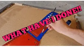 Custom painting a WWE universal title on a Paul Martin strap