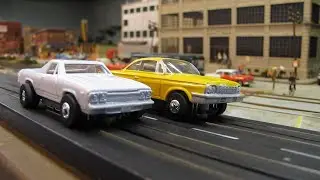 Slot Cars: Thunderjet Chevy Bel Air vs El Camino on Train Layout